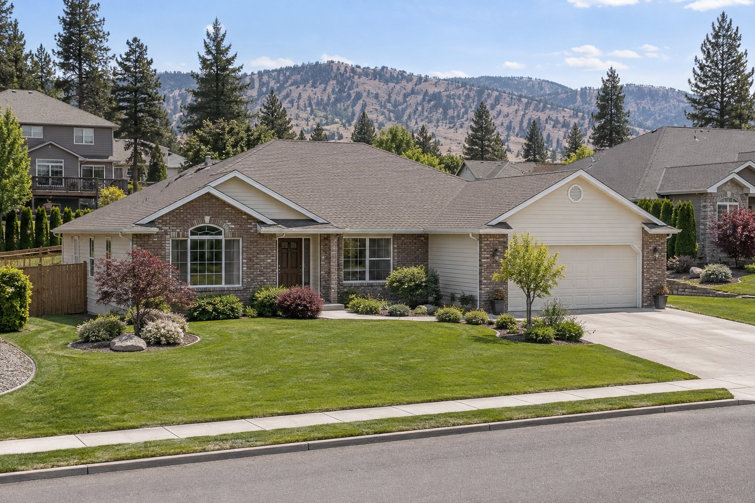 Illustration: Brick-and-cream ranch home with a broad front lawn and hills beyond the neighborhood